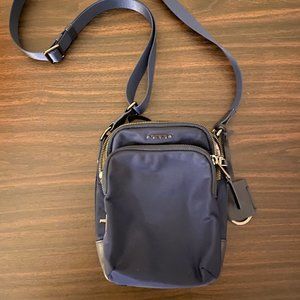 Navy Tumi "Ruma" crossbody bag